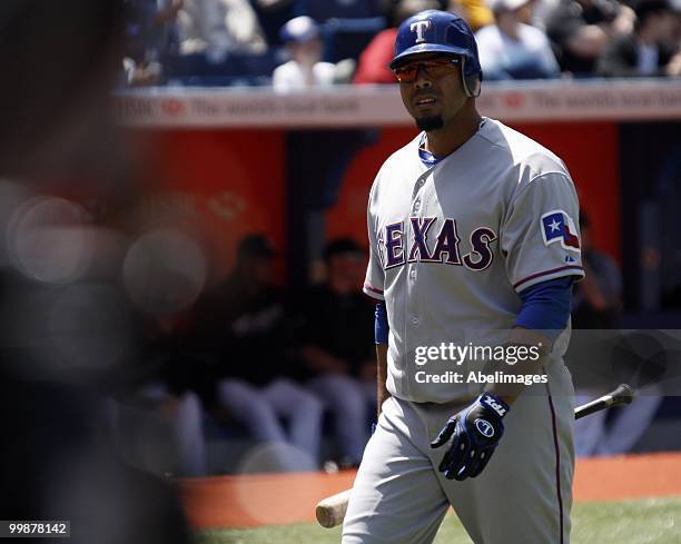 Nelson Cruz of the of the Texas Rangers gets called out during a MLB game at the Rogers Centre on May 16, 2010 in Toronto, Ontario, Canada.