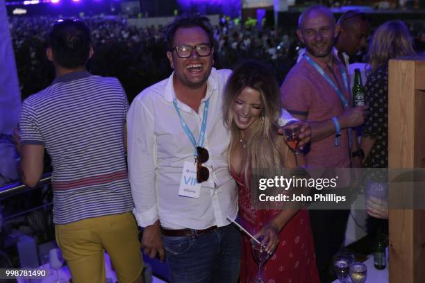 Alan Carr kisses Crissie Rhodes as Barclaycard present British Summer Time Hyde Park at Hyde Park on July 14, 2018 in London, England.