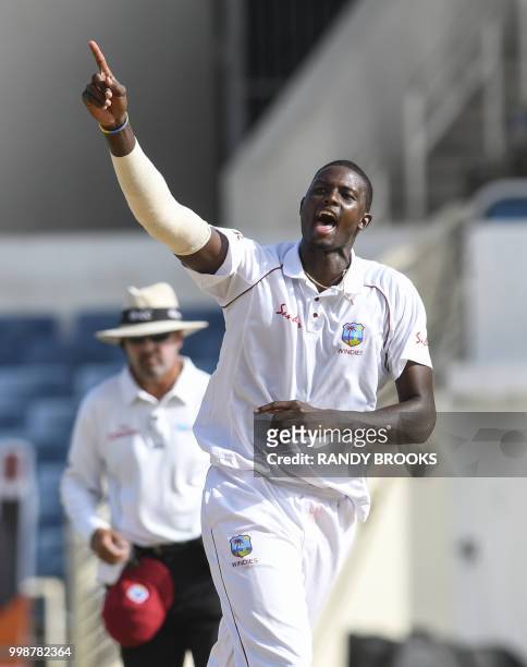 Jason Holder of West Indies celebrates the dismissal of Mushfiqur Rahim during day 3 of the 2nd Test between West Indies and Bangladesh at Sabina...