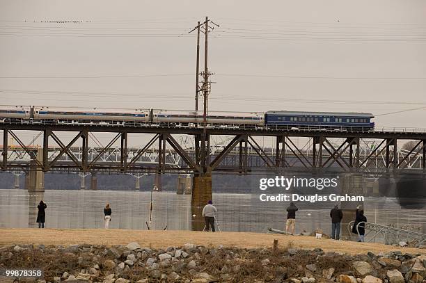 Train carrying President-elect Obama, Vice President elect Biden and their families crosses the historic bridge over the Susquehanna River at Havre...