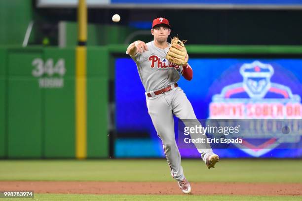 Scott Kingery of the Philadelphia Phillies throws towards first base during the third inning against the Miami Marlins at Marlins Park on July 14,...