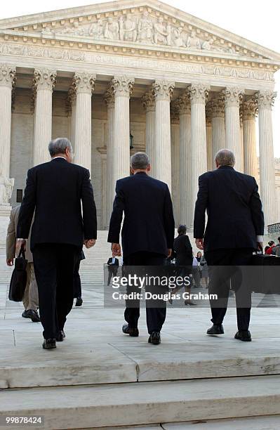 Floyd Abrams, Mitch McConnnell, R-KY., and Jan Baran walk to the Supreme Court for the start of the hearing on the campaign finance law suit.