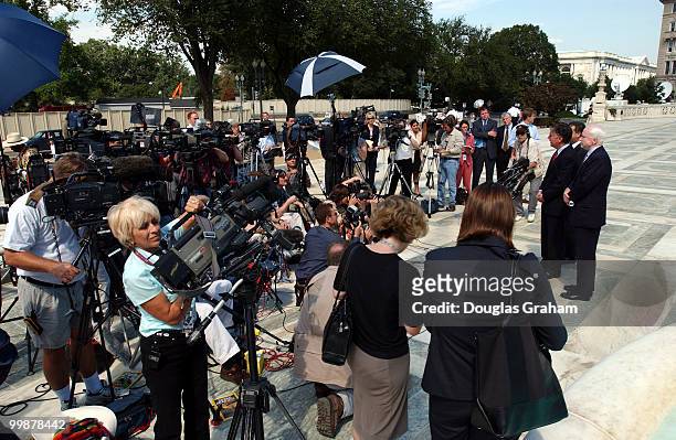 Russell D. Feingold, D-WI., Martin T. Meehan, D-MA., andJohn McCain, R-AZ.,U.S. Face the press during the lunch recess at the Supreme Court where...