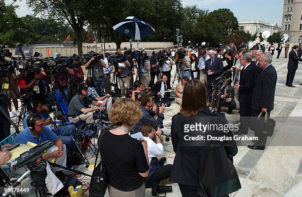Senator Mitch McConnell, R-KY and his legal team, Ken Star and Floyd Abrams talk with the press at the U.S. Supreme Court where oral arguments are...