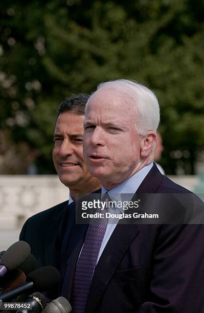 John McCain, R-AZ., and Russell D. Feingold, D-WI., face the press during the lunch recess at the Supreme Court where oral arguments are being made...