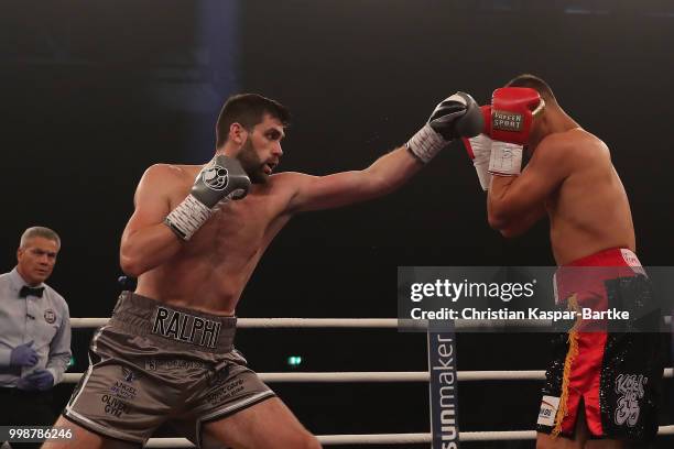 Rocky Fielding of Great Britain exchanges punches with Tyron Zeuge of Germany during their WBA Super Middleweight World Championship title fightat...