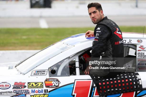 Ruben Garcia, Jr., driver of the Max Siegel Inc. Toyota, looks on during qualifying for the NASCAR K&N Pro Series East King Cadillac GMC Throwback...