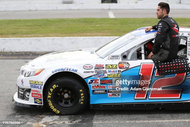 Ruben Garcia, Jr., driver of the Max Siegel Inc. Toyota, looks on during qualifying for the NASCAR K&N Pro Series East King Cadillac GMC Throwback...