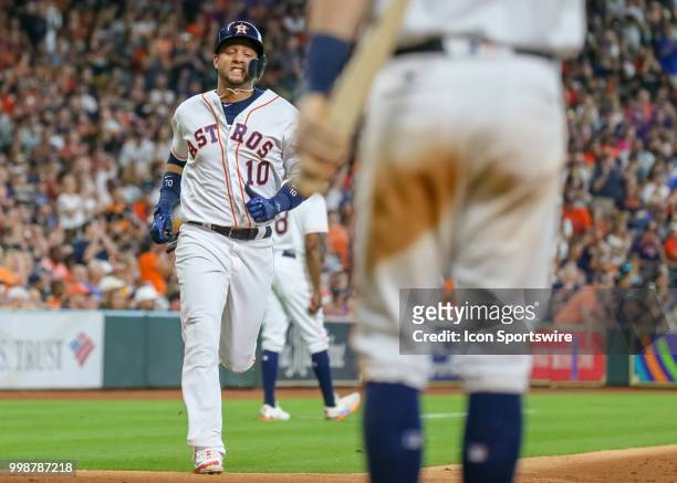 Houston Astros first baseman Yuli Gurriel scores a run in the top of the third inning during the baseball game between the Detroit Tigers and Houston...