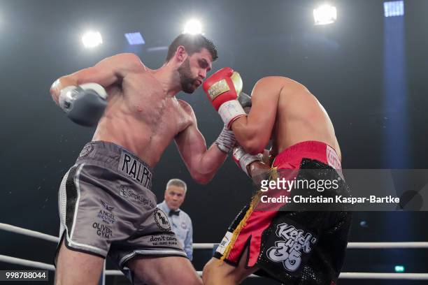 Rocky Fielding of Great Britain exchanges punches with Tyron Zeuge of Germany during their WBA Super Middleweight World Championship title fight at...