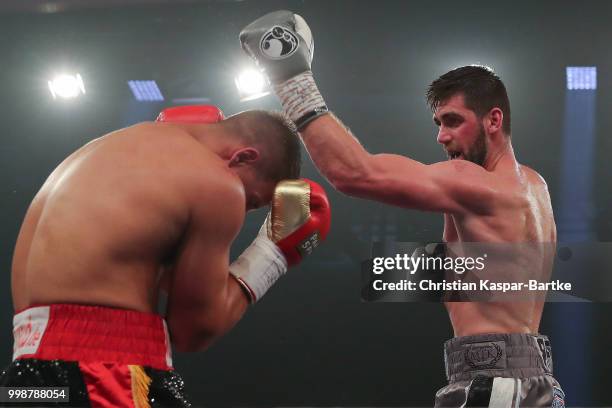 Rocky Fielding of Great Britain exchanges punches with Tyron Zeuge of Germany during their WBA Super Middleweight World Championship title fight at...