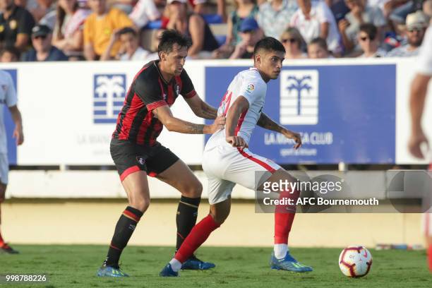 Joaquin Correa of Sevilla competes for the ball with Charlie Daniels of Bournemouth during AFC Bournemouth v Sevilla, pre-season friendly, at La...