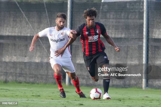 Nathan Ake of Bournemouth competes for the ball with Sergio Escudero of Sevilla during AFC Bournemouth v Sevilla, pre-season friendly, at La Manga...