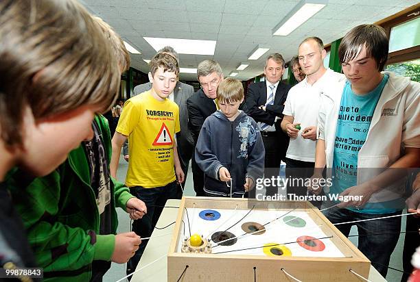 Thomas Bach , head of German Olympic Sports Association watches children playing during the Children's dreams 2011 awards ceremony at the...