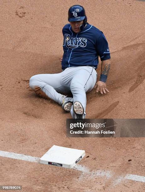 Wilson Ramos of the Tampa Bay Rays slides safely into third base against the Minnesota Twins during the fourth inning of the game on July 14, 2018 at...