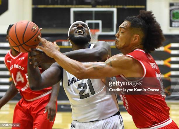 Kevin Pinkney of Team Challenge ALS and Buddha Boyd of the Fort Hood Wounded Warriors battle for a rebound during the game at Eagle's Nest Arena on...