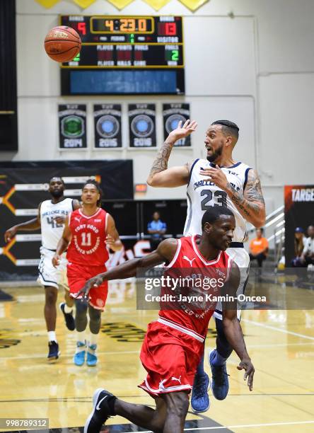 Jejuan Player of the Fort Hood Wounded Warriors defends a pass by Sean Marshall of Team Challenge ALS during the game at Eagle's Nest Arena on July...