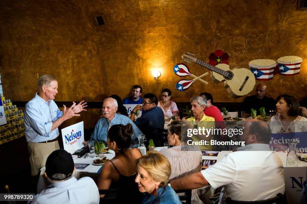 Senator Bill Nelson, a Democrat from Florida, left, speaks during a Vecinos de Nelson canvass kickoff event in the Little Havana neighborhood of...