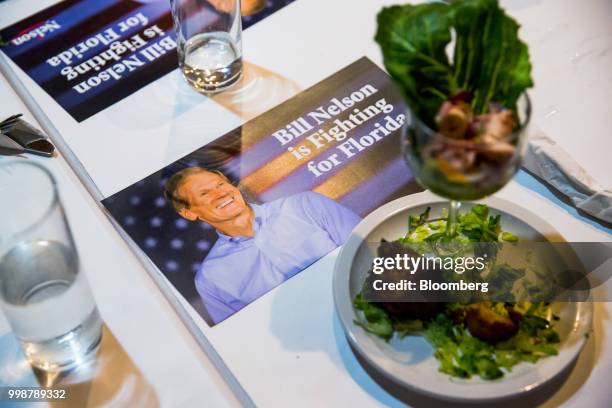 Campaign cards for Senator Bill Nelson, a Democrat from Florida, sit during a Vecinos de Nelson canvass kickoff event in the Little Havana...