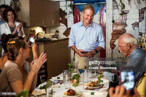 Senator Bill Nelson, a Democrat from Florida, center, smiles during a Vecinos de Nelson canvass kickoff event in the Little Havana neighborhood of...