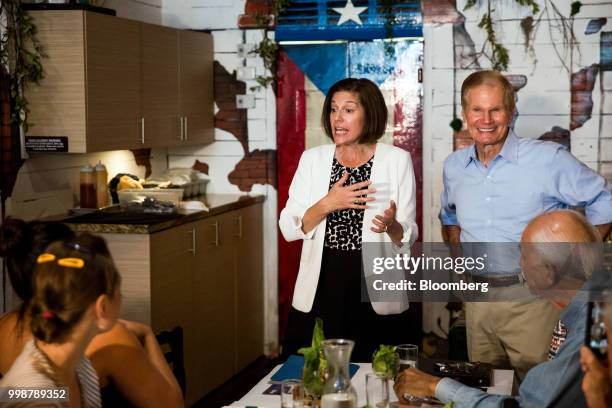 Senator Catherine Cortez Masto, a Democrat from Nevada, center, speaks as Senator Bill Nelson, a Democrat from Florida, right, smiles during a...