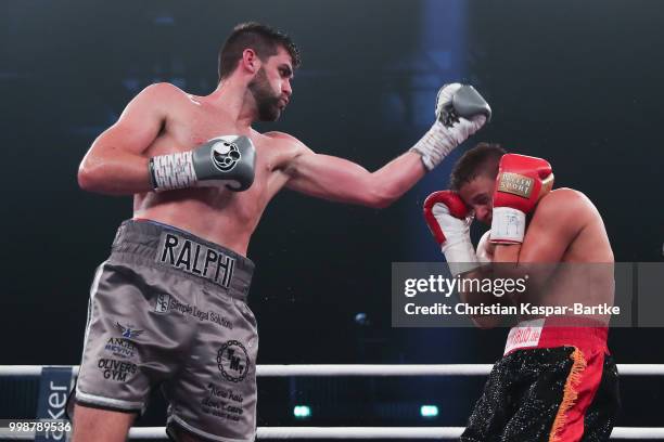 Rocky Fielding of Great Britain exchanges punches with Tyron Zeuge of Germany during their WBA Super Middleweight World Championship title fightat...