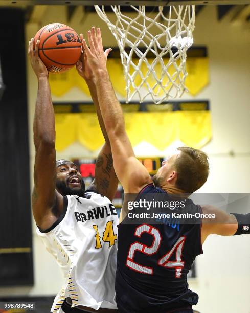 Taylor Braun of Eberlein Drive defends a shot by Justin Edwards of the Broad St. Brawlers in the game at Eagle's Nest Arena on July 14, 2018 in Los...