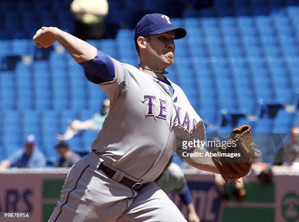 Colby Lewis of the Texas Rangers throws against the Toronto Blue Jays during a MLB game at the Rogers Centre on May 16, 2010 in Toronto, Ontario,...