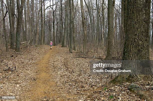 Hiker makes her way south on the Verlin Smith Trail at G. Thompson Wildlife Management Area in Fauquier County Virginia.