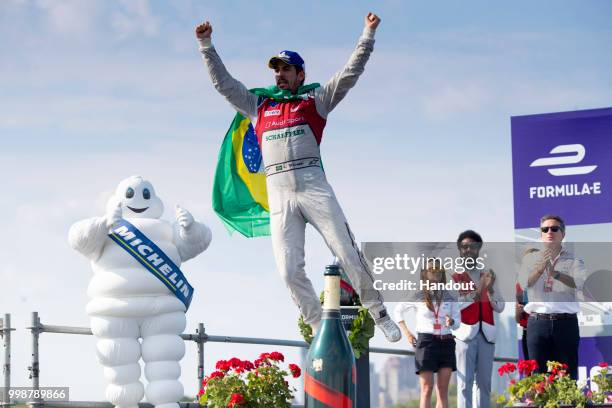 In this handout provided by FIA Formula E, Lucas Di Grassi , Audi Sport ABT Schaeffler, Audi e-tron FE04, celebrates on the podium after winning the...