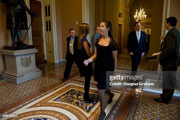 Mark Warner, D-VA., along with his daughters Madison and Eliza walks through the Ohio Clock Corridor of the U.S. Capitol after a "mock" swearing in...