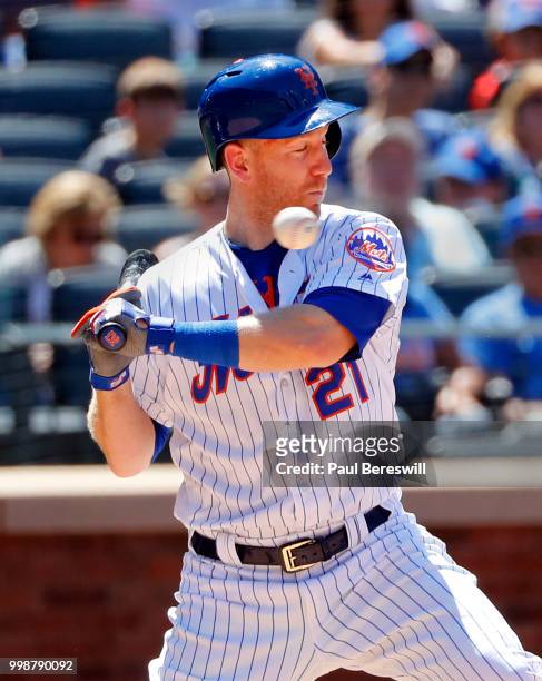 Todd Frazier of the New York Mets reacts to a pitch near his chin during an interleague MLB baseball game against the Tampa Bay Rays on July 8, 2018...