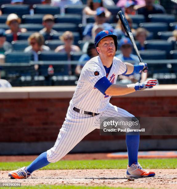 Todd Frazier of the New York Mets follows through during an interleague MLB baseball game against the Tampa Bay Rays on July 8, 2018 at Citi Field in...