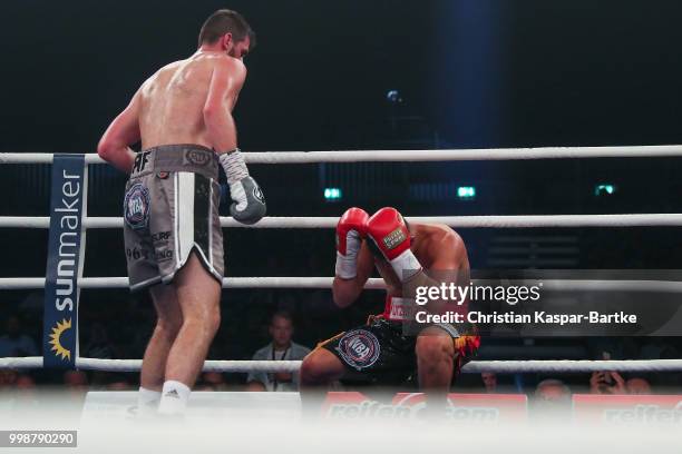 Rocky Fielding of Great Britain brings Tyron Zeuge of Germany to a technical knock down at Baden-Arena on July 14, 2018 in Offenburg, Germany.