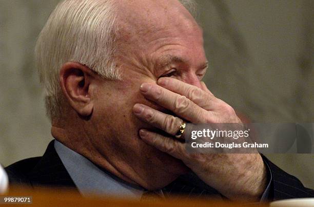 Chairman John McCain covers his face as he laughs at the testimony of William Worfel former tribal council member of the Coushatta Tribe of Louisiana...