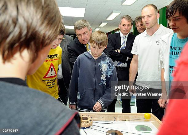 Thomas Bach , head of German Olympic Sports Association watches children playing during the Children's dreams 2011 awards ceremony at the...