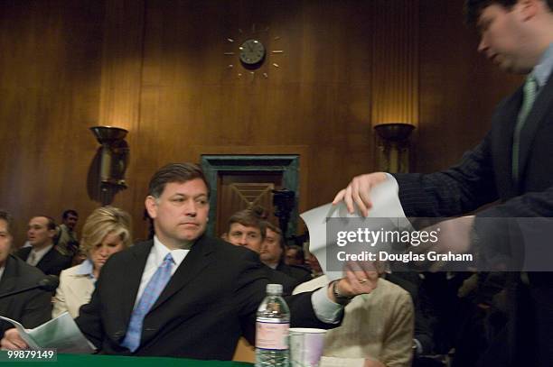 Former U.S. Attorneys David Iglesias and John McKay look on as Bud Cummins hands over the e-mail he sent warning the other U.S. Attorneys about...