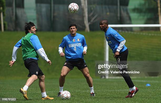 Diego Milito , Javier Zanetti and Samuel Eto o of FC Internazionale Milano attend an FC Internazionale Milano training session during a media open...