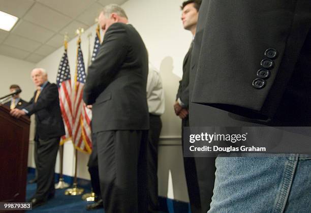 Robert Loria, Iraq war veteran who lost his arm in Iraq listens during a news conference with VoteVets and Iraq war veterans in opposition to the...