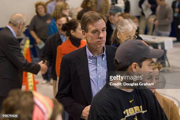 Senate candidate Mark Warner waits in line to vote on November 4th, 2008 at Lyles Crouch School, in Alexandria, Virginia. He was accompanied by his...