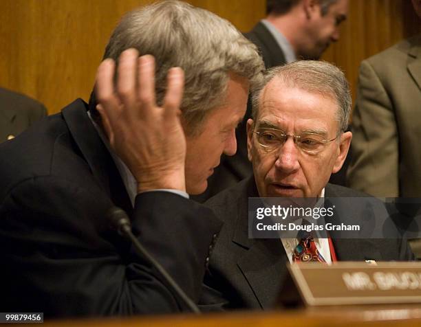 The new Chairman Max Baucus, D-MT., of the Senate Finance Committee talks with Chairman Charles Grassley, R-IA., before the start of the Full...