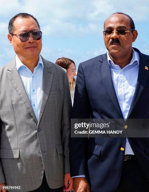 Antigua & Barbuda's Prime Minister Gaston Browne and China's Ambassador to the country, Wang Xianmin, are seen in Codrington, Barbuda, 12 July, 2018...