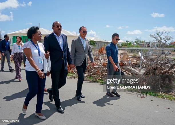 Antigua & Barbuda's Prime Minister Gaston Browne and China's Ambassador to the country, Wang Xianmin , and delegates survey the rebuilding progress...