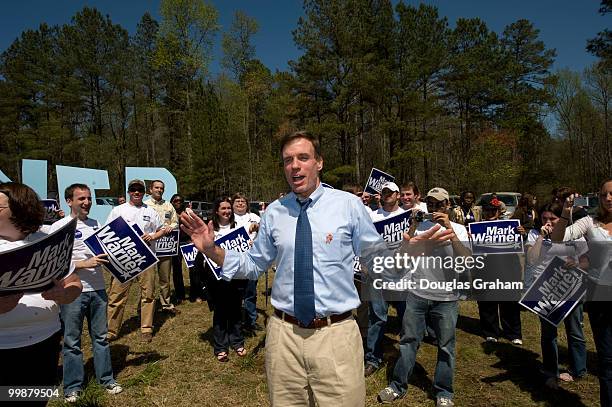 Former Gov. Mark Warner, D-Va., autographs Neil Jones hat at the Wakefield Shad Planking, April 16, 2008 in Wakefield, Virginia.