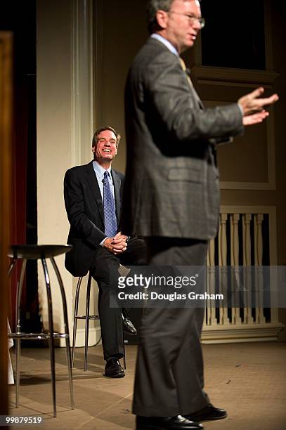 Former Governor of Virginia Mark Warner listens to Eric E. Schmidt the CEO of Google during a town hall meeting in downtown Blacksburg Virginia at...