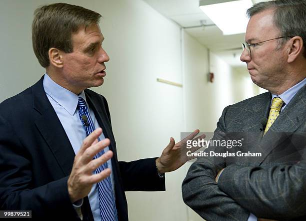 Former Governor of Virginia Mark Warner and Eric E. Schmidt the CEO of Google talk back stage before the start of the town hall meeting in downtown...