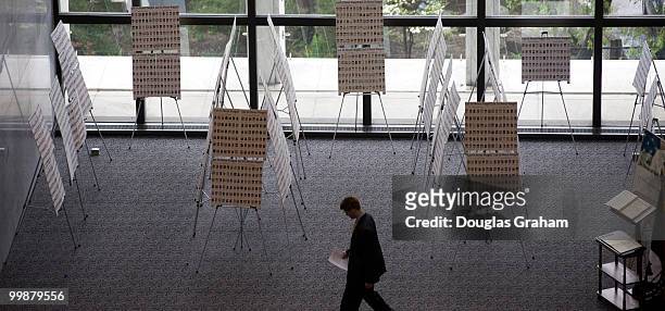 Staffer walks past the war memorial on the 5th floor of the Senate Hart Office Building, April 21, 2008.