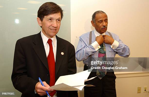 Dennis J. Kucinich, D-OH., and John Conyers, D-MI., before the start of a news conference on a third alternative to war. Congresswoman Jackson Lee...