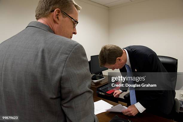 Communications Director Kevin Hall helps his boss Mark Warner, D-VA., get things in order during their first day in the U.S. Senate on January 6,...