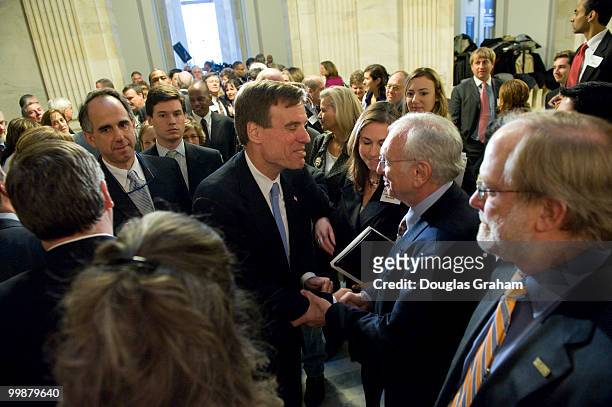 Mark Warner, D-VA., is greeted by well wishers in a standing room only Russell Caucus Room during his first day in the U.S. Senate on January 6, 2009.